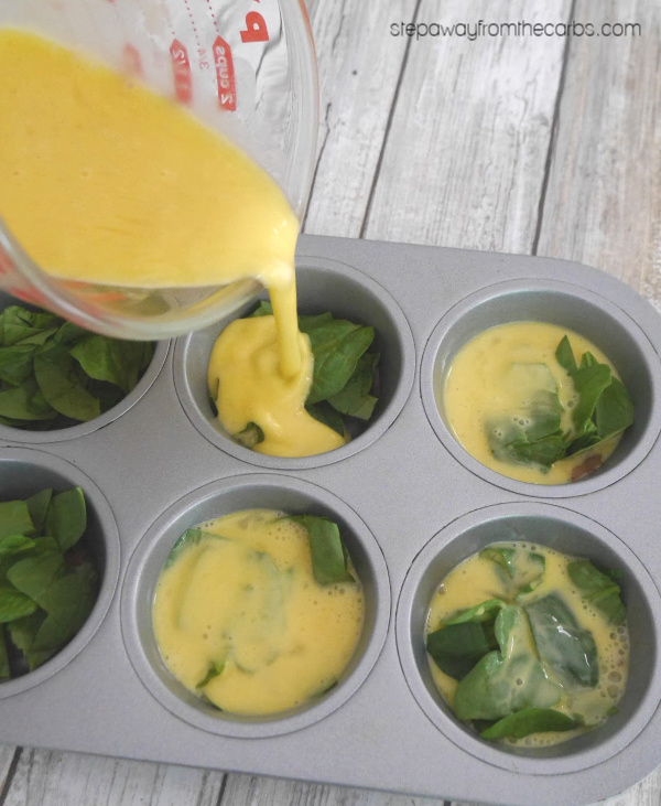 Low Carb Layered Breakfast Muffins - with egg, bacon, spinach, and cheese! Keto and gluten free recipe.