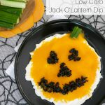 Low Carb Jack O'Lantern Dip graphic with a cheddar pumpkin face and cucumber sticks