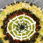 This spider web dip is perfect for a Halloween party! Low carb, keto, LCHF, and gluten free recipe.