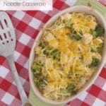 Low carb cheesy chicken noodle casserole in a green baking dish on a red gingham tablecloth