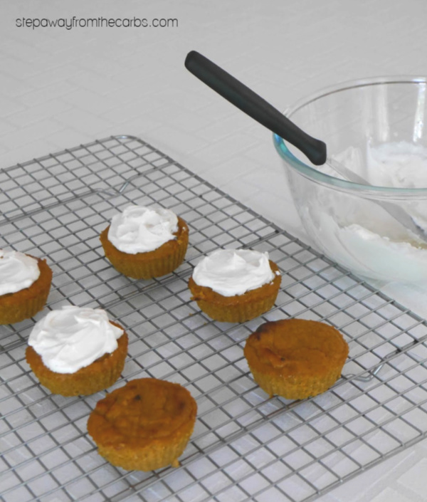 topping the keto pumpkin muffins with low carb frosting