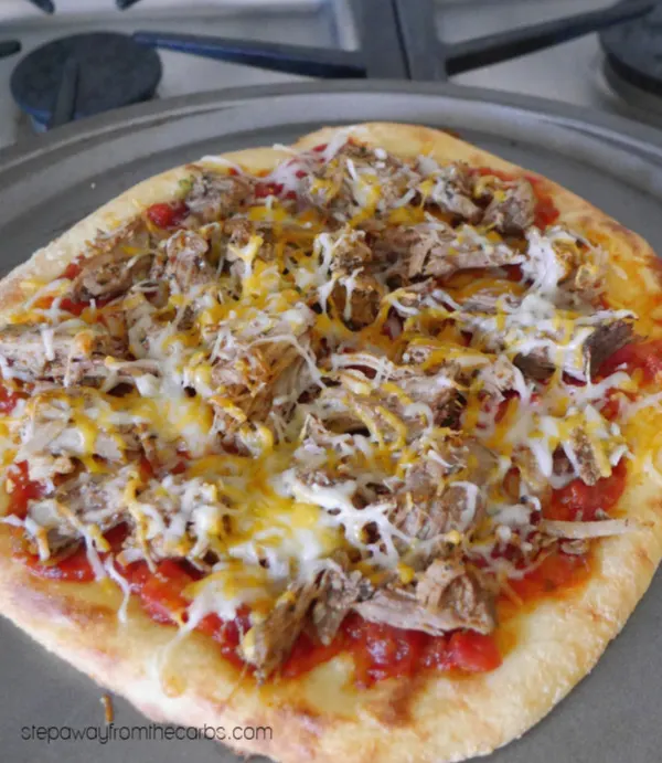 Low Carb Mexican Pizza - made with Fathead dough, salsa, keto carnitas, cheese, and more!