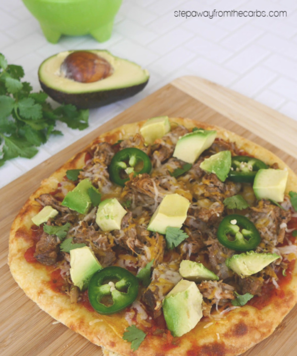 Low Carb Mexican Pizza - made with Fathead dough, salsa, keto carnitas, cheese, and more!