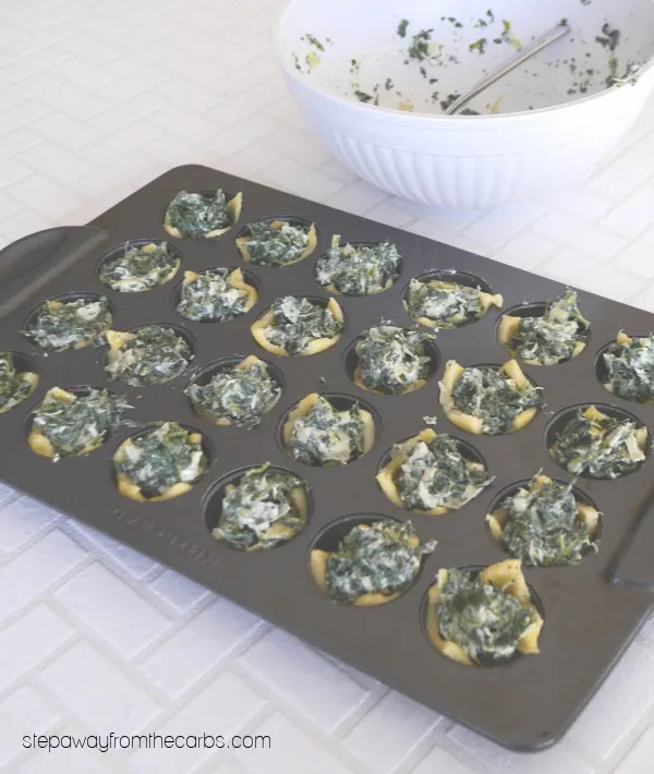 Low Carb Spinach Dip Bites - tasty little morsels made with Fathead dough, spinach, and artichoke!