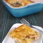 A square of low carb sausage bake on a white plate with a fork
