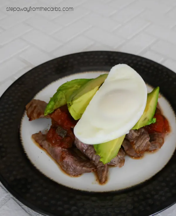 Low Carb Ranchero Benedict - a spicy brunch with steak, poached eggs, avocado, salsa, and chipotle Hollandaise.