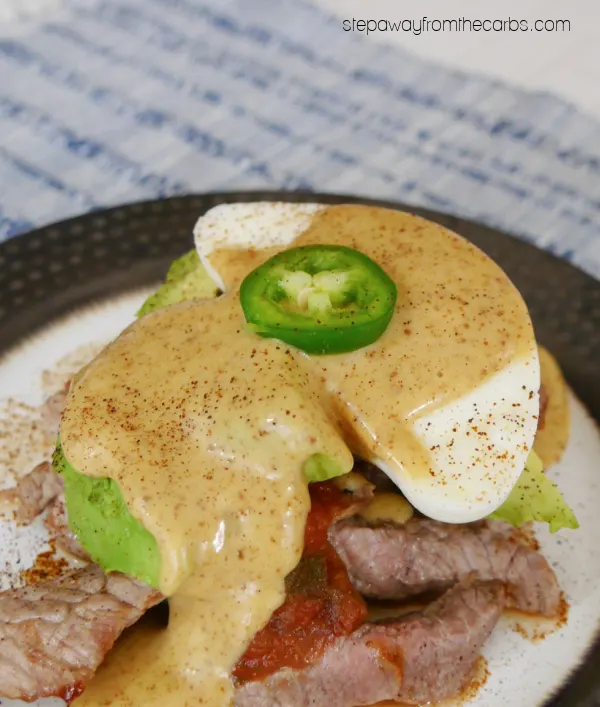 Low Carb Ranchero Benedict - a spicy brunch with steak, poached eggs, avocado, salsa, and chipotle Hollandaise.