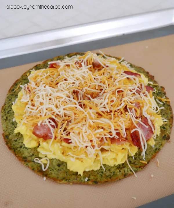 Low Carb Breakfast Pizza - with scrambled eggs, bacon, and cheese on a keto-friendly crust