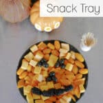 Keto Halloween Snack Tray graphic with a jack-o'-lantern shaped cheese and veggie platter