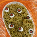 Low carb Halloween spaghetti with mozzarella and olive eyeballs on pesto edamame noodles