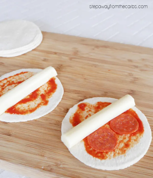 Keto Pizza Roll-Ups - less than 1g net carb each! With pepperoni, sugar free pizza sauce, tortillas, and cheese!
