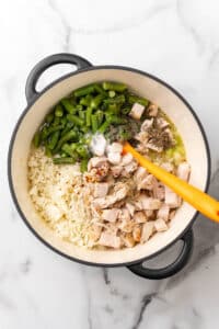 Diced turkey, cauliflower rice, green beans and seasonings added to the soup pot