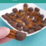 Low Carb Chocolate Dipped Pecans Pinterest graphic with a hand holding a dipped pecan