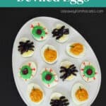 Halloween Spider Deviled Eggs Pinterest pin showing a platter of spooky deviled eggs