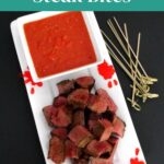 Halloween Steak Bites Pinterest graphic with an overhead view of steak bites, dip and skewers