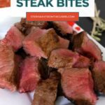 Halloween Steak Bites Pinterest graphic with a close-up of medium-rare steak bites