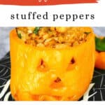 Halloween stuffed peppers pin: a jack-o'-lantern orange bell pepper stuffed with chicken and cauliflower rice