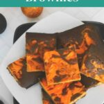 Keto Halloween Brownies Pinterest graphic with brownies on a white plate