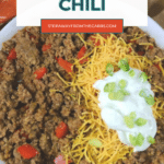 Low carb chili in a white bowl with cheddar, sour cream and green onions, Pinterest graphic