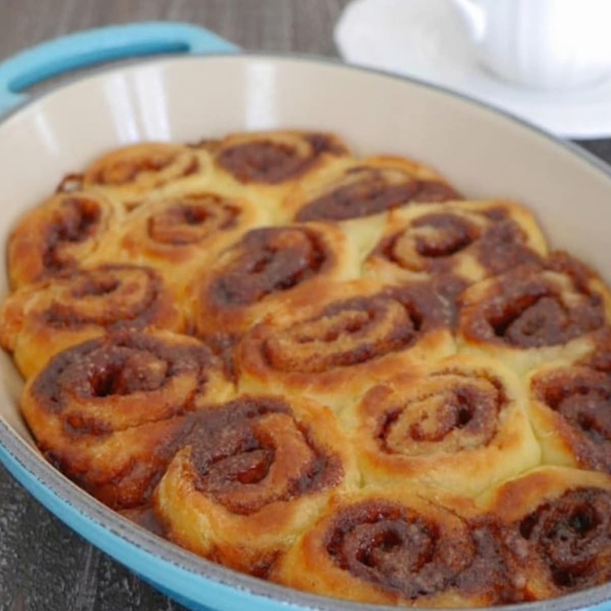 Low carb cinnamon rolls baked in a blue oval dish