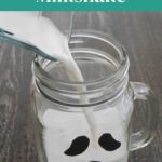Low Carb Ghost Milkshake Pinterest graphic with the milkshake being poured into a ghost mug
