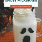 Low Carb Ghost Milkshake Pinterest graphic with whipped cream and a black straw
