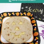 Halloween quesadillas Pinterest pin with a jack-o'-lantern face cut into a low carb tortilla