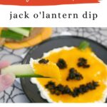 Low carb jack o'lantern dip Pinterest graphic with a cucumber stick scooping the dip