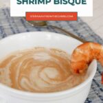 Low Carb Shrimp Bisque pin with a creamy bisque in a white bowl