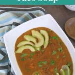 Low Carb Taco Soup Pinterest graphic showing taco soup topped with avocado and lime