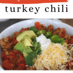 Low carb turkey chili Pinterest graphic with a bowl of chili and toppings
