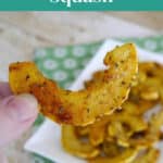Roasted delicata squash slice held up over a plate, Pinterest graphic