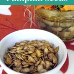Keto roasted pumpkin seeds in a white bowl, a low carb fall snack