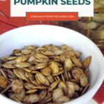 Keto roasted pumpkin seeds in a white bowl on a fall table