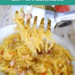 Spaghetti squash all'arrabbiata Pinterest graphic with a forkful of squash strands