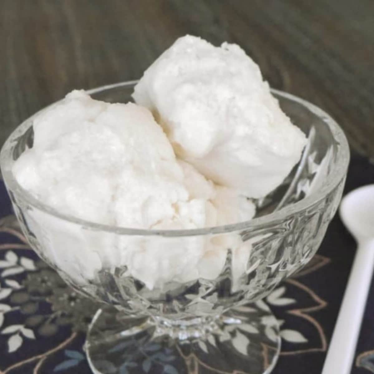 Sugar free no carb ice cream scooped into a glass dessert bowl