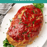 Whole keto turkey meatloaf on a white platter - Pinterest pin