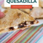 Pinterest pin of a hand holding a wedge of low carb chocolate quesadilla